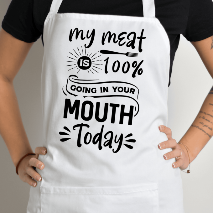 Balta prijuostė su spauda „Meat in Your Mouth“